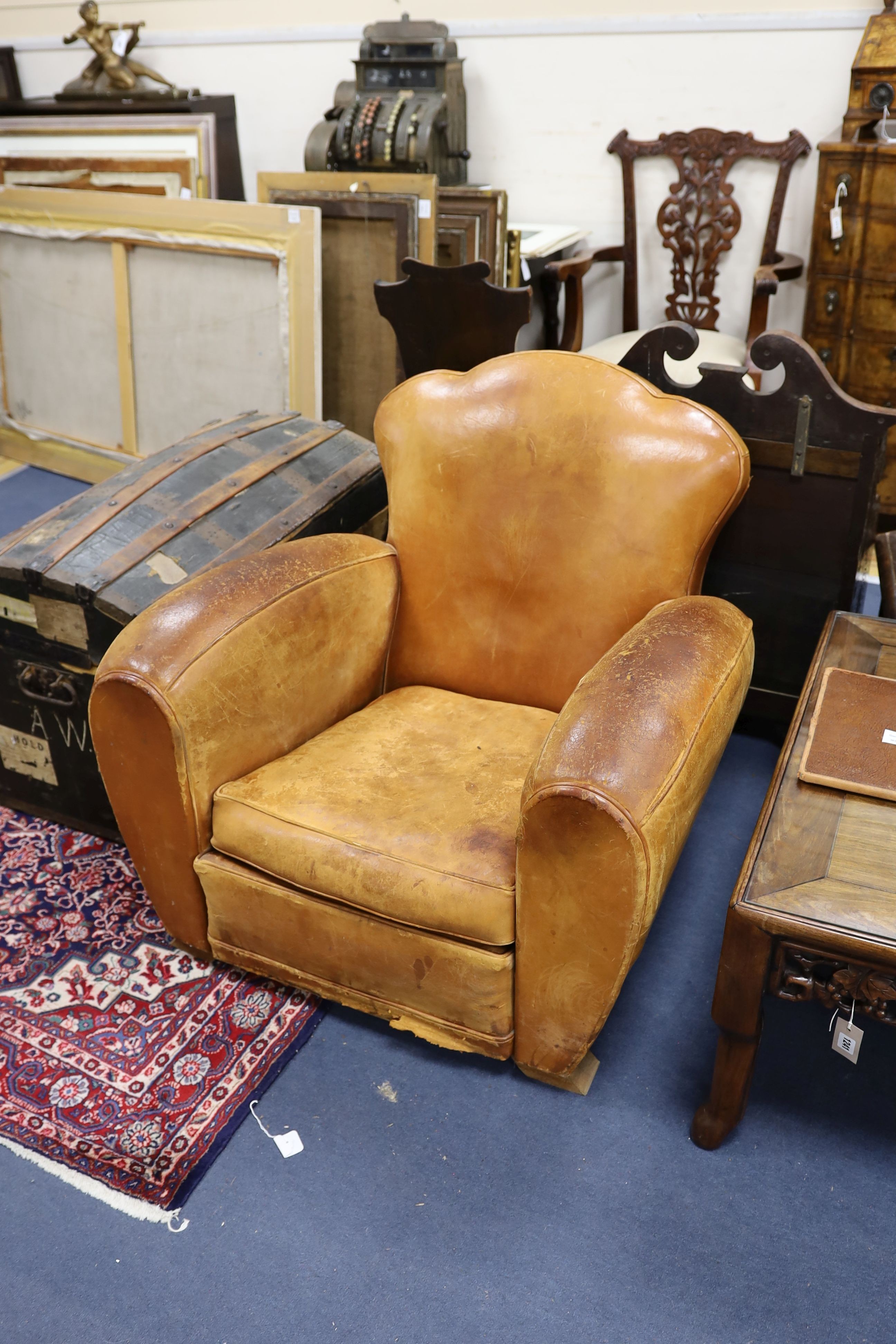 A pair of mid 20th century French tan leather club armchairs, width 90cm, depth 84cm, height 80cm